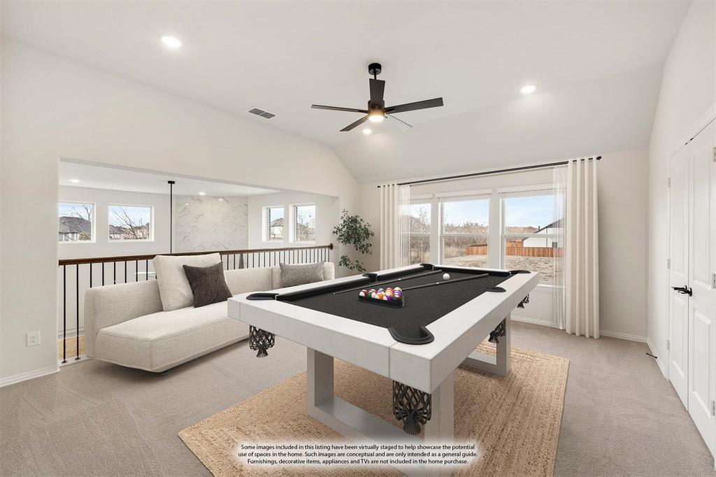 1630 Secco Way Rockwall, TX 75032 - Photo 27 of 40 a living room with furniture a table and a large window