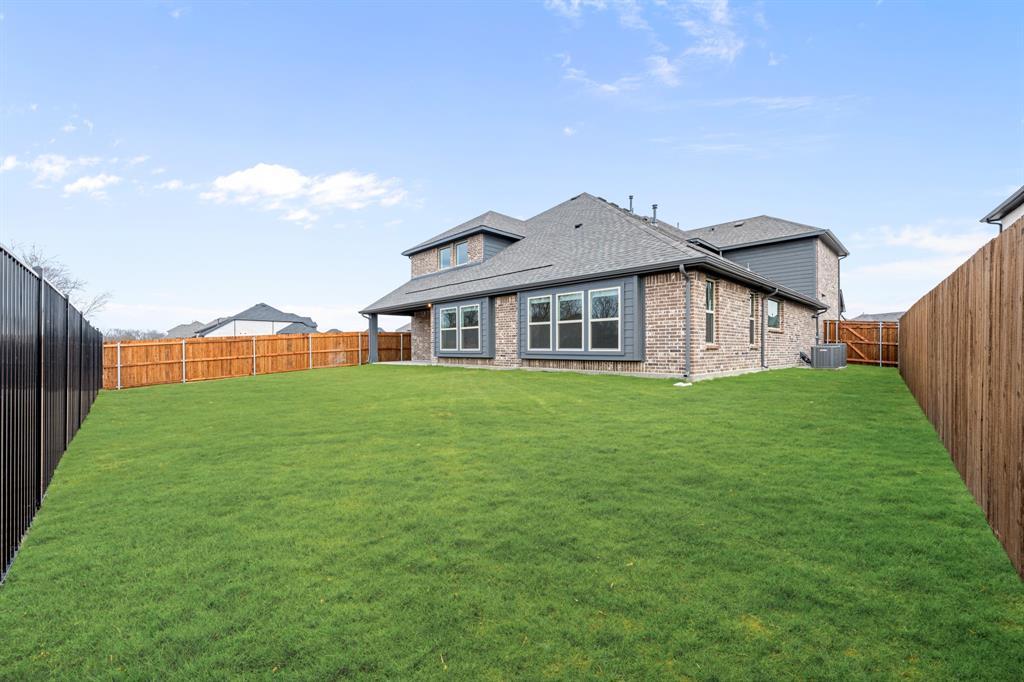 1630 Secco Way Rockwall, TX 75032 - Photo 39 of 40 a front view of a house with a yard