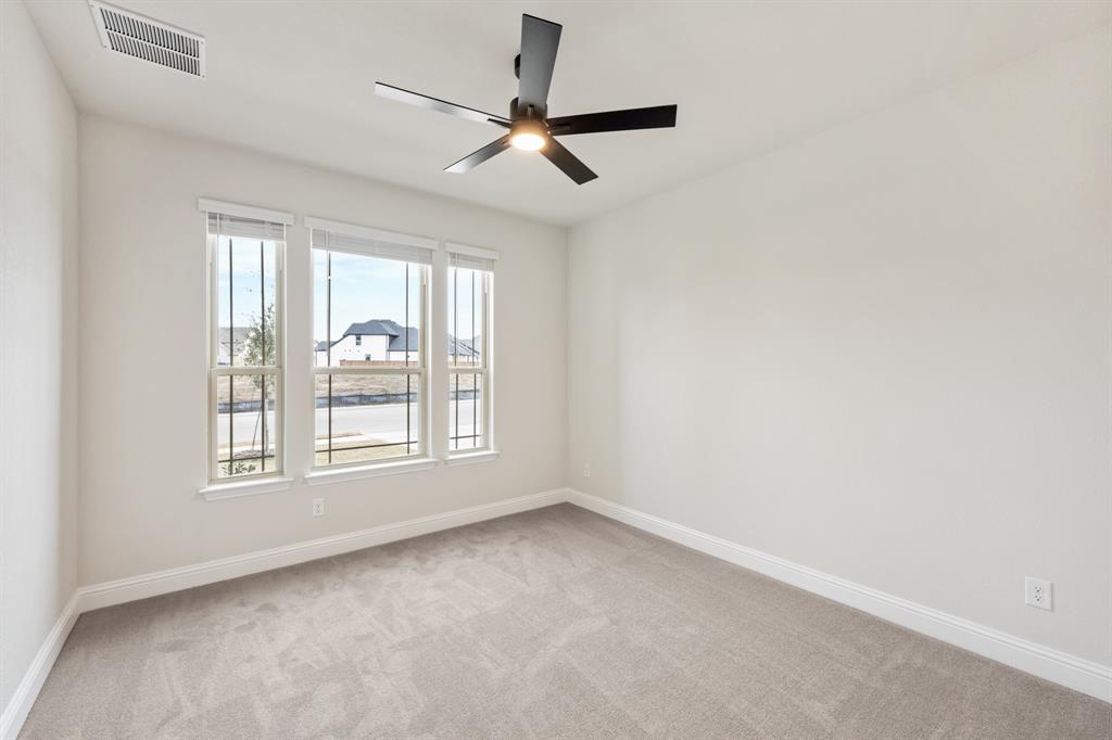 1630 Secco Way Rockwall, TX 75032 - Photo 8 of 40 an empty room with a window