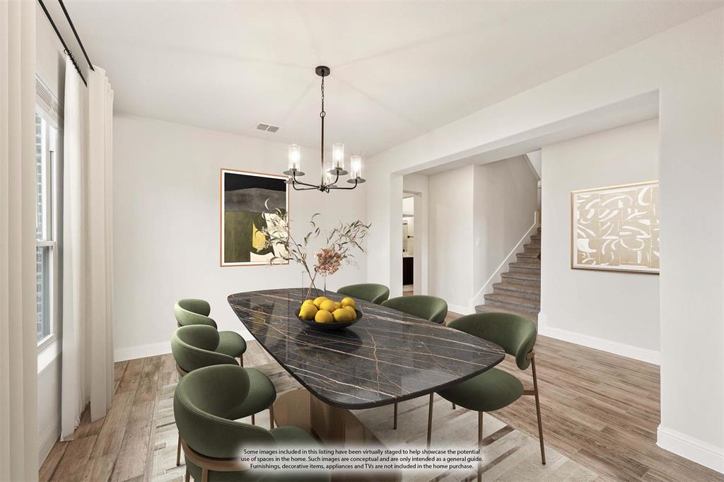 1630 Secco Way Rockwall, TX 75032 - Photo 10 of 40 a view of a dining room with furniture and wooden floor