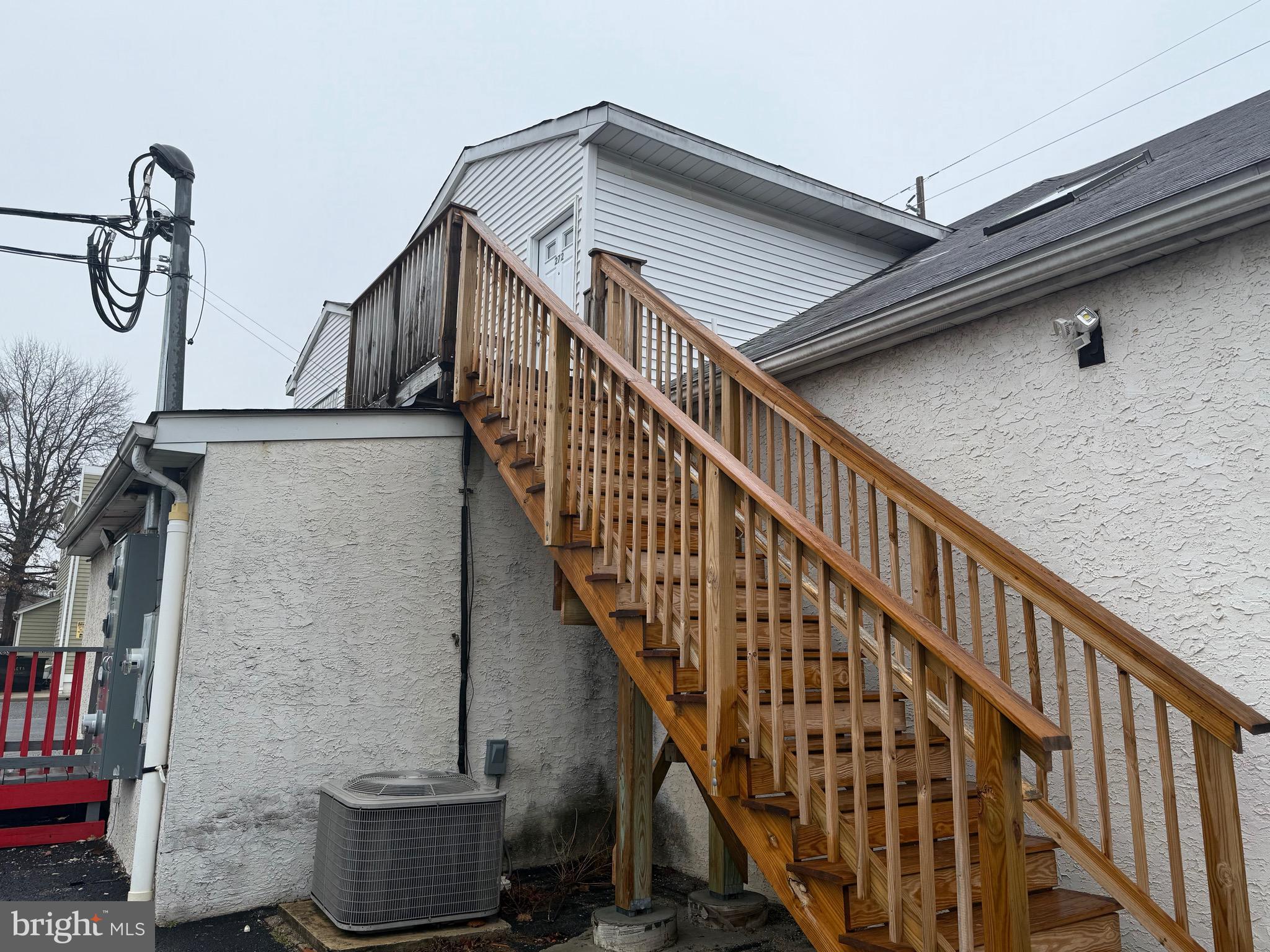 272 Shell Road Carneys Point, NJ 08069 - Photo 2 of 14 a view of staircase with wooden floor and metal railing