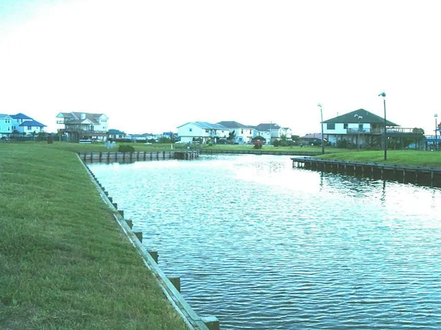 a view of a lake with a big yard