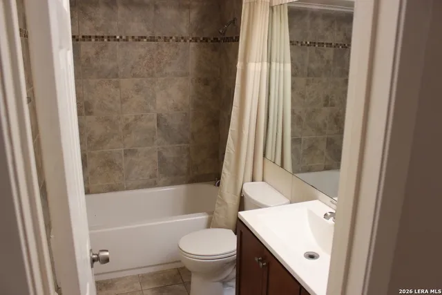 a bathroom with a sink a toilet and a bathtub