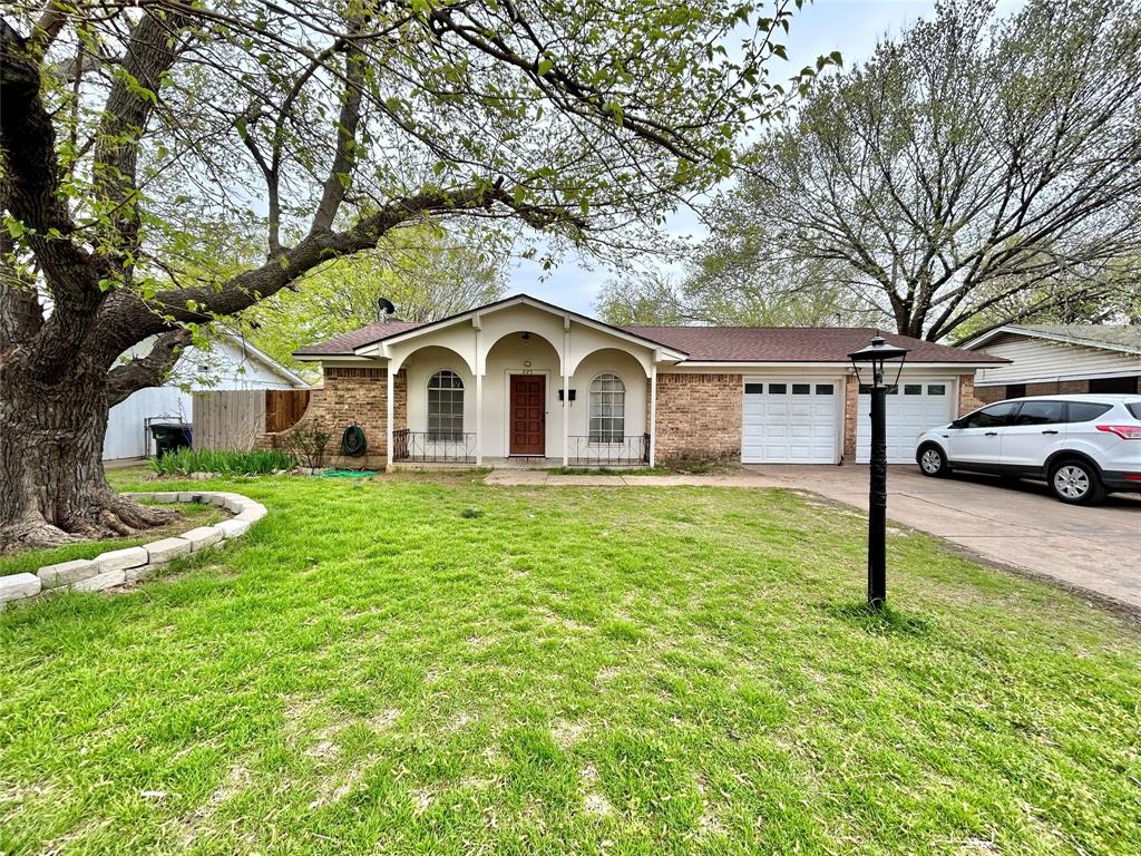 a house view with a garden space