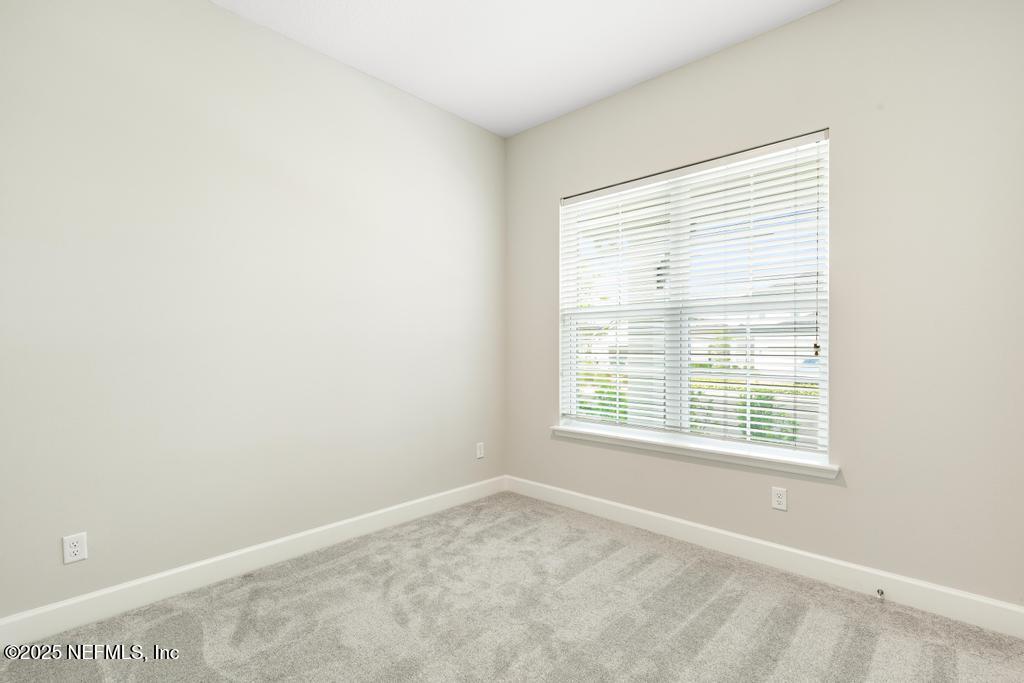 92 Alston Drive St. Augustine, FL 32092 - Photo 11 of 53 a view of an empty room with a window