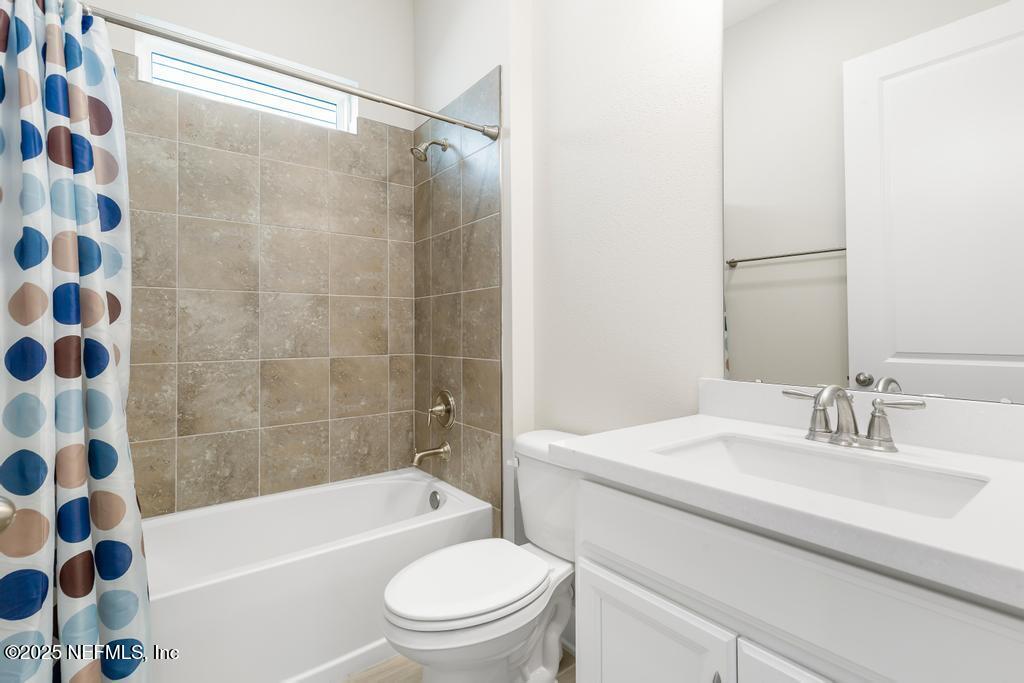 92 Alston Drive St. Augustine, FL 32092 - Photo 13 of 53 a bathroom with a sink a toilet and shower