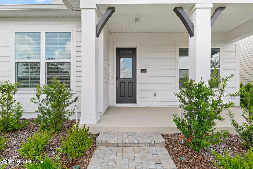 92 Alston Drive St. Augustine, FL 32092 - Photo 2 of 53 a front view of a house with garden
