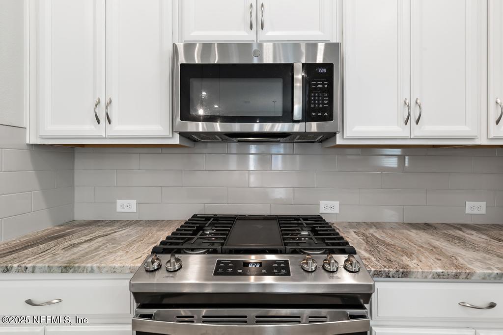92 Alston Drive St. Augustine, FL 32092 - Photo 22 of 53 a stove top oven sitting inside of a kitchen