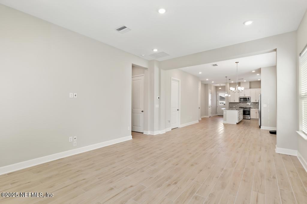 92 Alston Drive St. Augustine, FL 32092 - Photo 32 of 53 a view of a kitchen with a sink and a refrigerator
