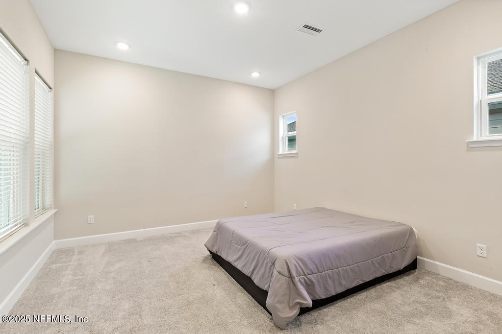 92 Alston Drive St. Augustine, FL 32092 - Photo 35 of 53 a bedroom with a bed and a window