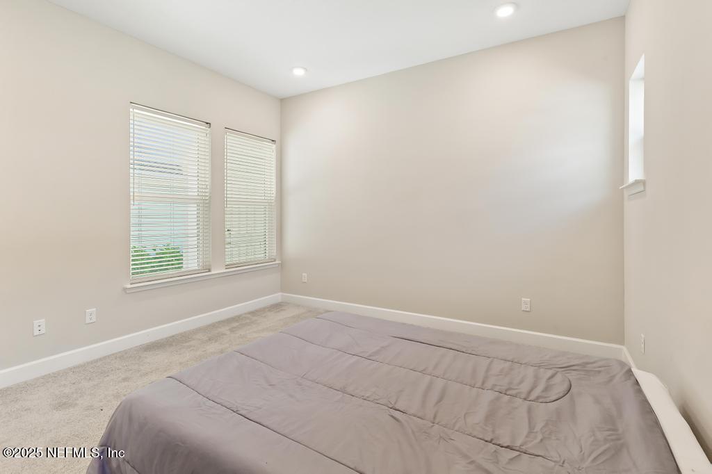 92 Alston Drive St. Augustine, FL 32092 - Photo 36 of 53 a bedroom with a bed and a window