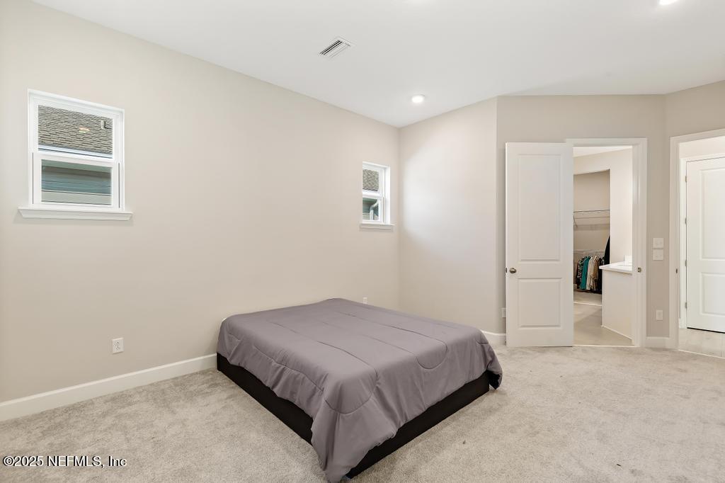 92 Alston Drive St. Augustine, FL 32092 - Photo 37 of 53 a bedroom with a bed and a window