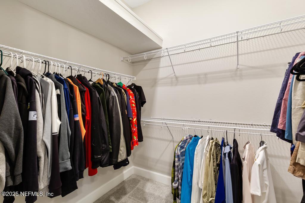 92 Alston Drive St. Augustine, FL 32092 - Photo 43 of 53 a view of walk in closet with clothes