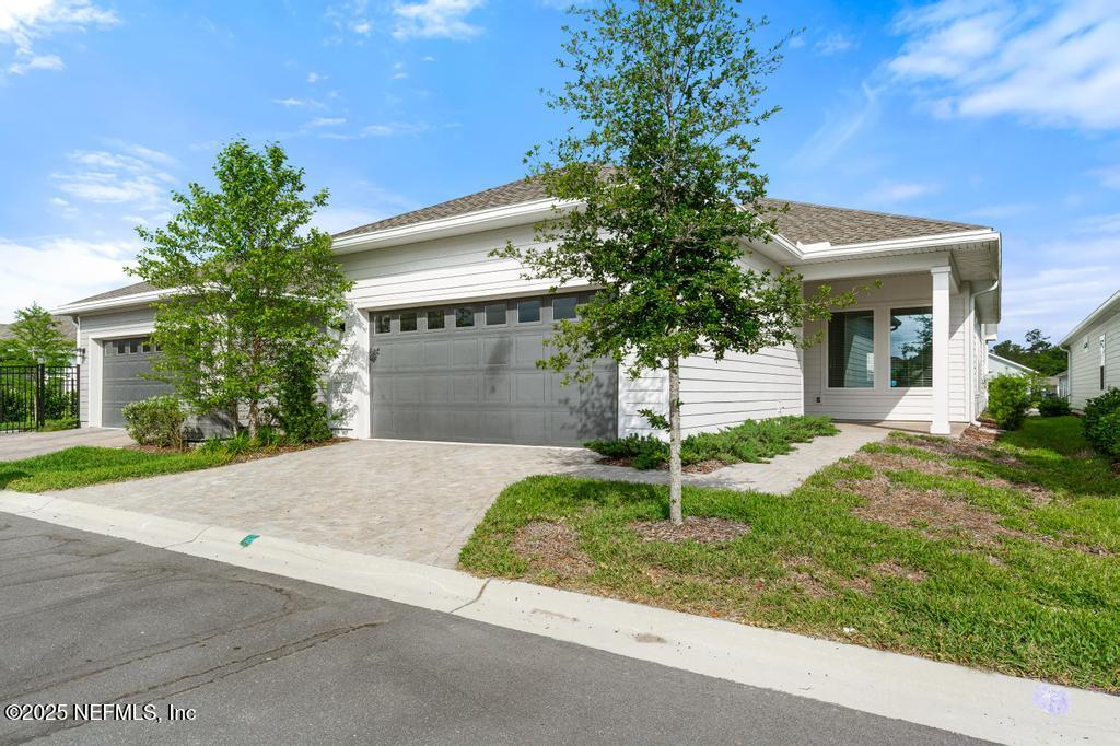 92 Alston Drive St. Augustine, FL 32092 - Photo 48 of 53 a view of a house with a yard and tree