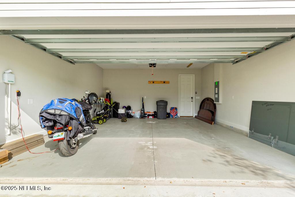 92 Alston Drive St. Augustine, FL 32092 - Photo 53 of 53 a view of a garage with a bike and a chandelier