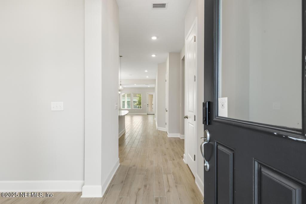 92 Alston Drive St. Augustine, FL 32092 - Photo 6 of 53 a view of a hallway with wooden floor