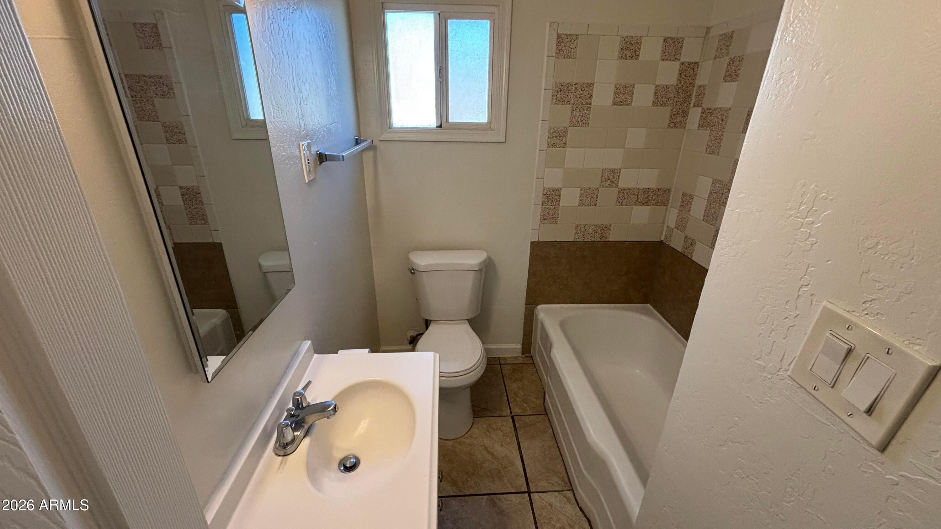 419 North 20th Street, Unit 2 Phoenix, AZ 85006 - Photo 10 of 15 a bathroom with a toilet and a shower