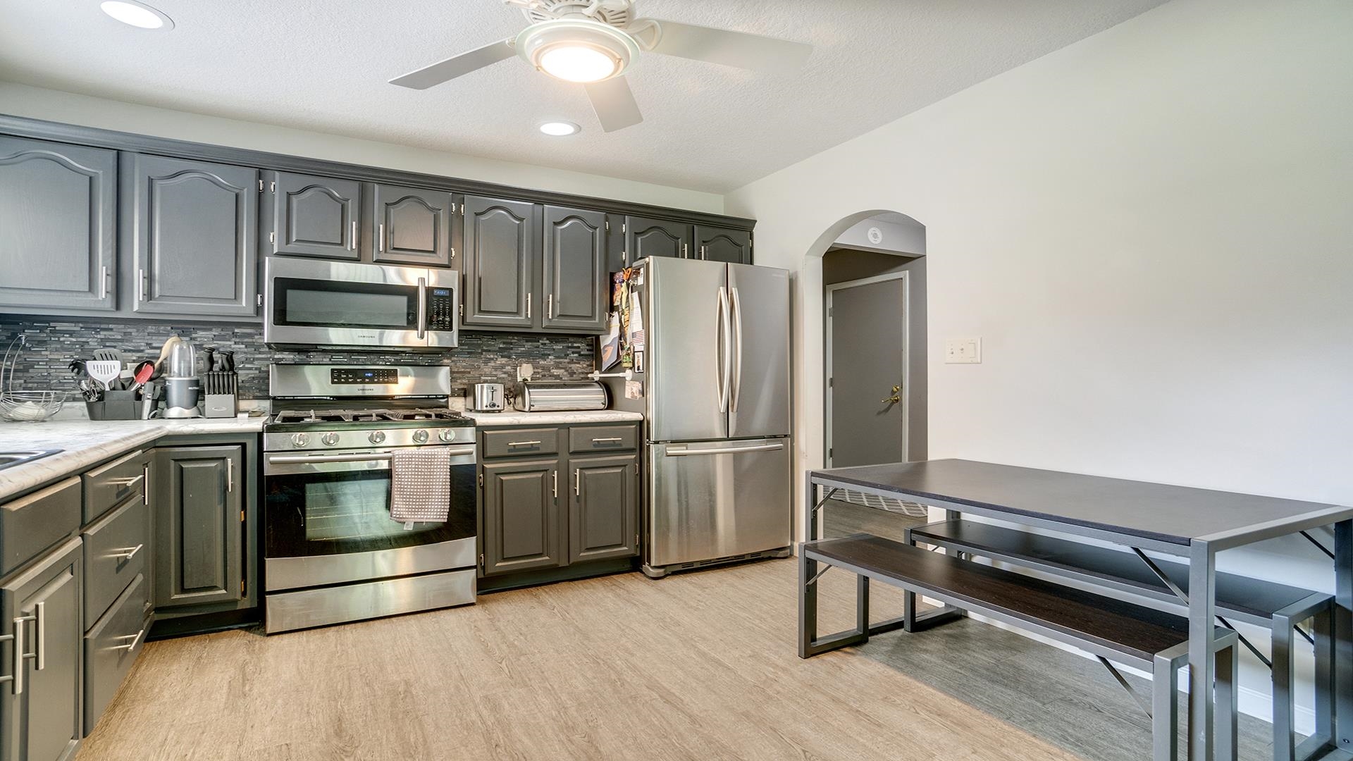 1065 Idle Oak Run Dixon, IL 61021 - Photo 11 of 44 a kitchen with granite countertop a refrigerator stove and microwave