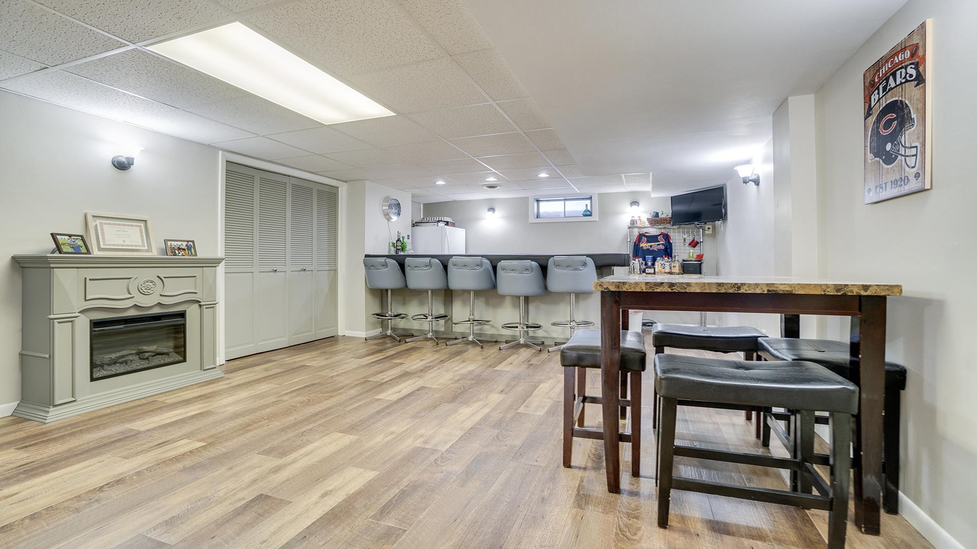1065 Idle Oak Run Dixon, IL 61021 - Photo 31 of 44 a living room with furniture a fireplace and kitchen view