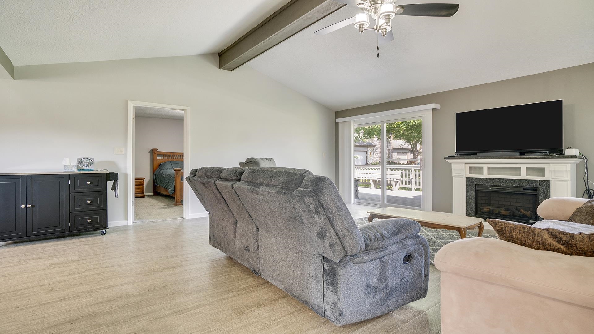 1065 Idle Oak Run Dixon, IL 61021 - Photo 5 of 44 a living room with furniture a flat screen tv and a fireplace