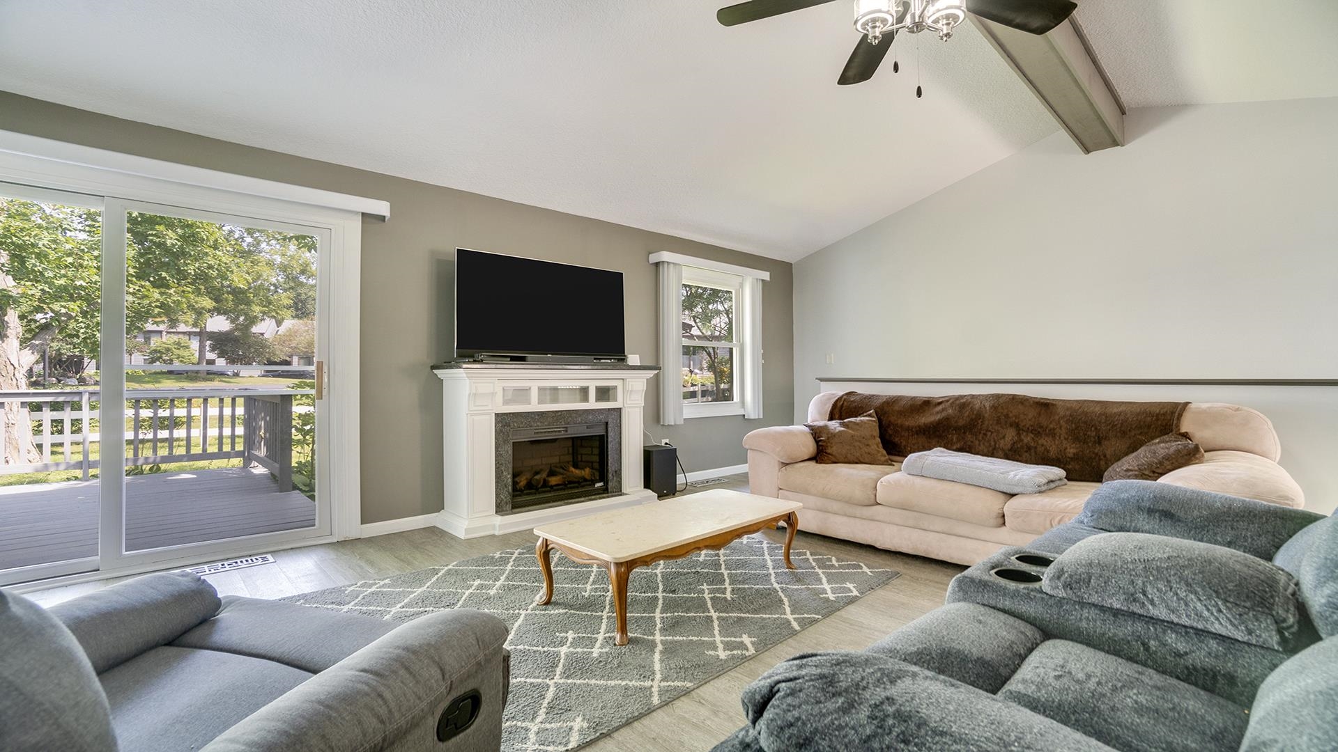 1065 Idle Oak Run Dixon, IL 61021 - Photo 6 of 44 a living room with furniture a flat screen tv and a fireplace