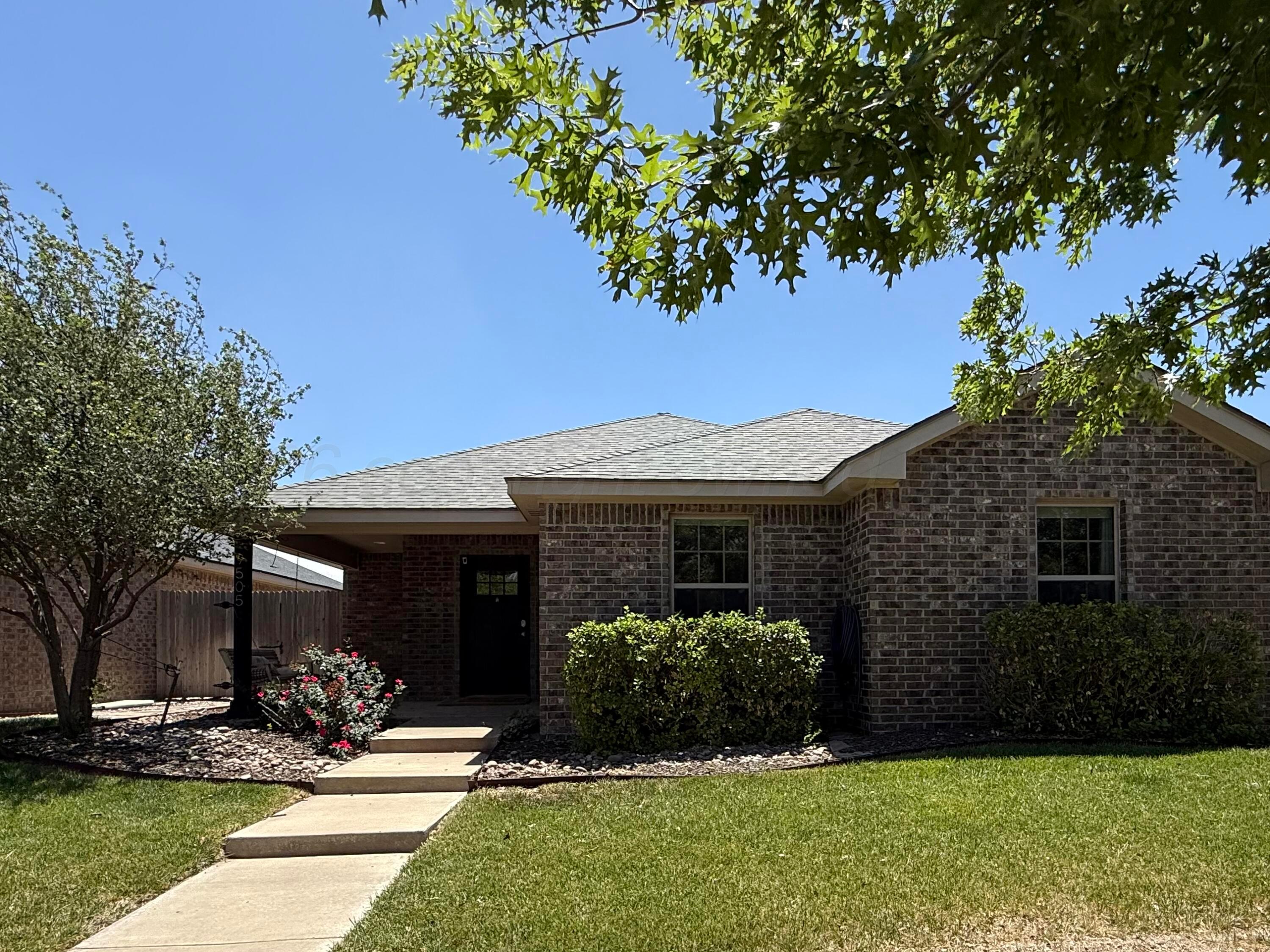 9505 Perry Avenue Amarillo, TX 79119 - Photo 21 of 21 a front view of a house with a yard