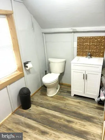 a bathroom with a toilet and a sink