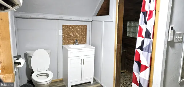 a bathroom with a toilet and a sink
