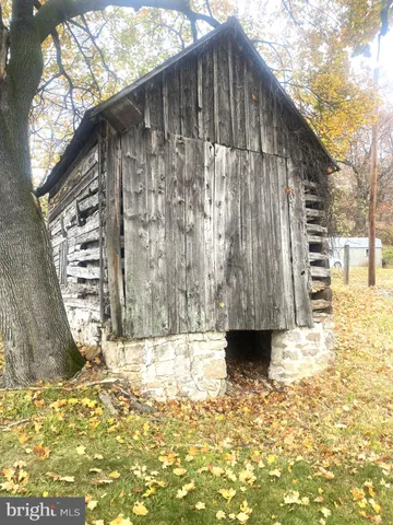 a black white building with a white fence