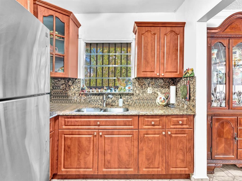 2347 Southwest 18th Street Miami, FL 33145 - Photo 17 of 46 a bathroom with granite countertop a sink and a window