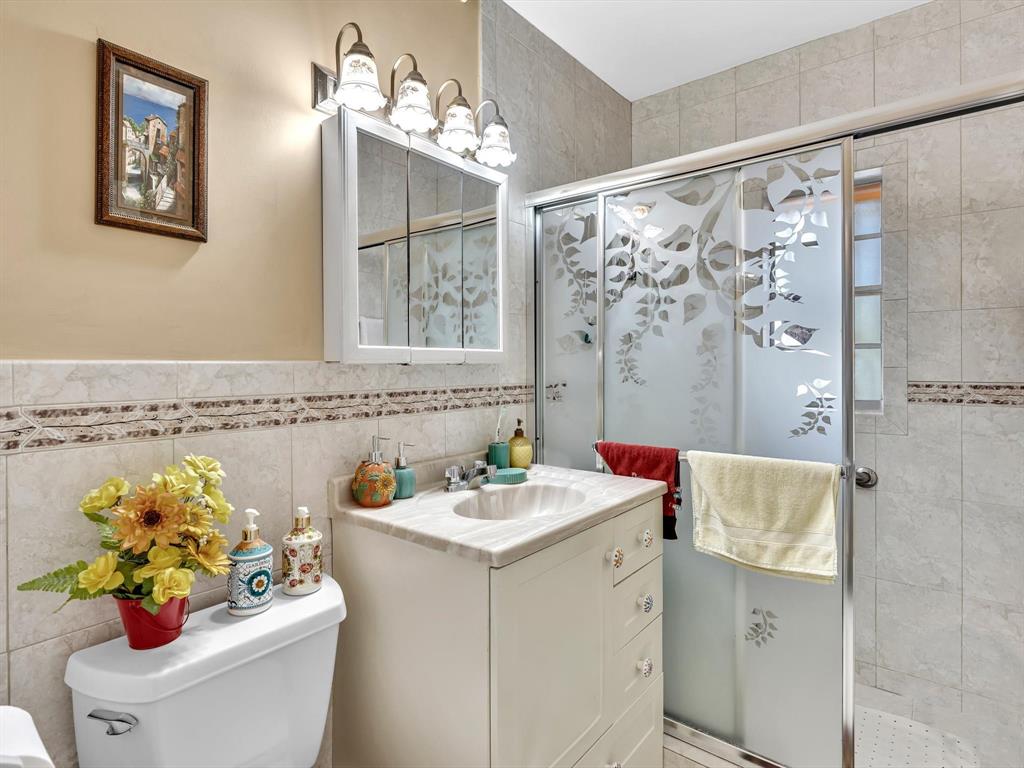 2347 Southwest 18th Street Miami, FL 33145 - Photo 24 of 46 a bathroom with a sink mirror and vanity