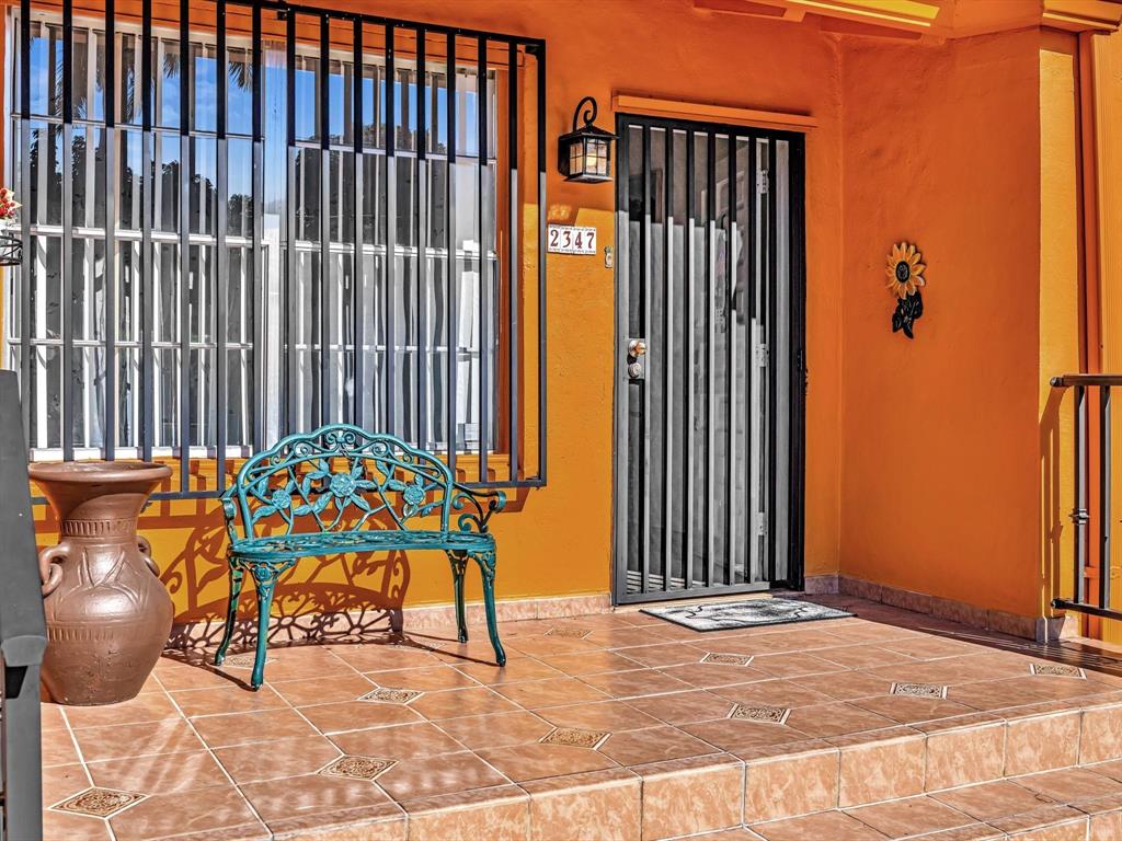 2347 Southwest 18th Street Miami, FL 33145 - Photo 4 of 46 a balcony with table and chairs