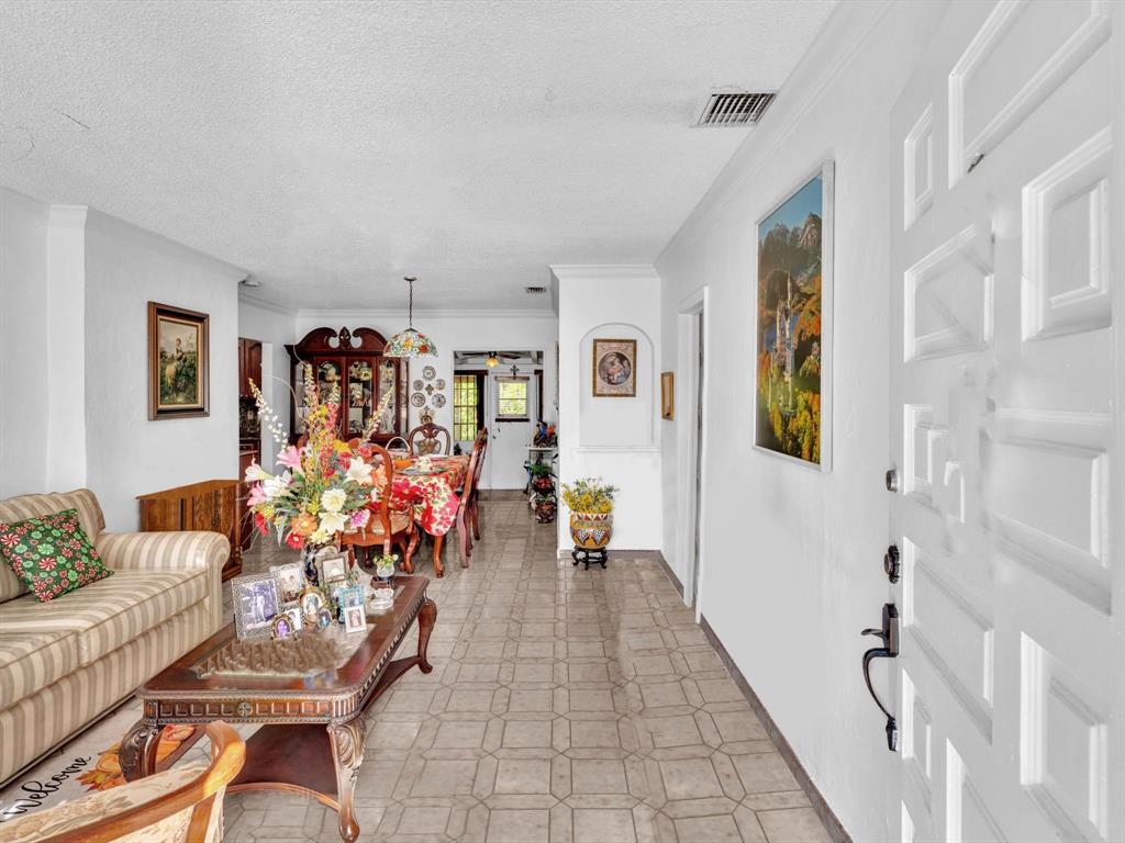 2347 Southwest 18th Street Miami, FL 33145 - Photo 7 of 46 a living room with furniture and a potted plant