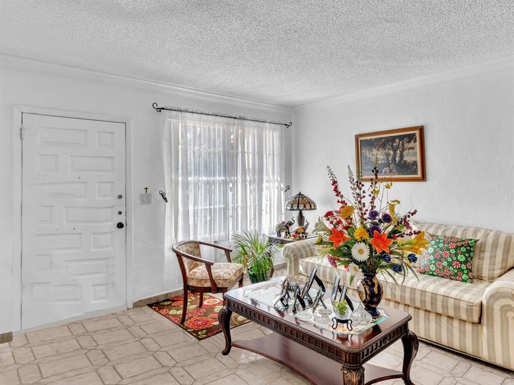 2347 Southwest 18th Street Miami, FL 33145 - Photo 9 of 46 a living room with furniture and flowers
