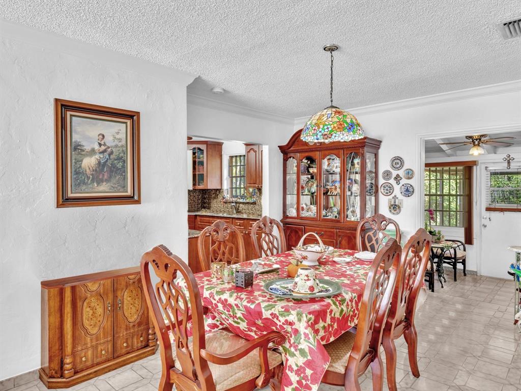 2347 Southwest 18th Street Miami, FL 33145 - Photo 10 of 46 a dining room with furniture a chandelier and window