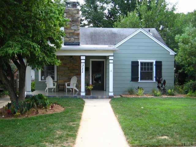 311 Perry Street Raleigh, NC 27608 - Photo 1 of 12 a view of a house with a yard and sitting area