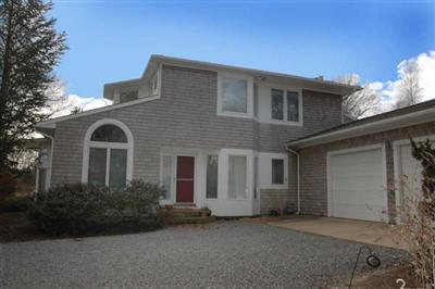 40 Mashnee Road Bourne, MA 02532 - Photo 1 of 12 a front view of a house with garden