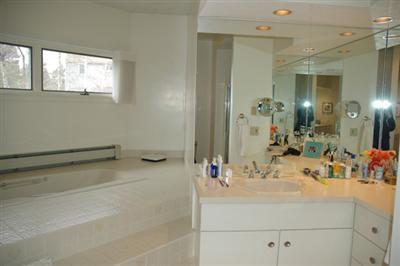 40 Mashnee Road Bourne, MA 02532 - Photo 11 of 12 a bathroom with a sink and a mirror