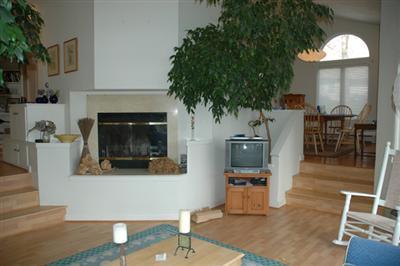 40 Mashnee Road Bourne, MA 02532 - Photo 3 of 12 a living room with furniture and a fireplace