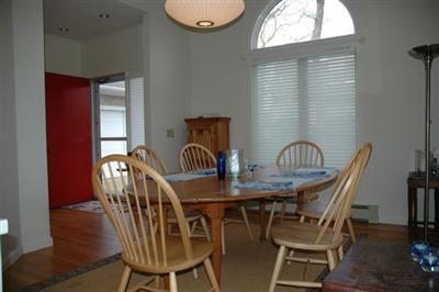 40 Mashnee Road Bourne, MA 02532 - Photo 6 of 12 a view of a dining room and livingroom with furniture window and wooden floor