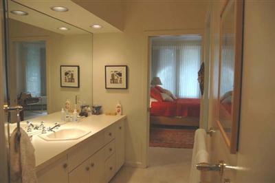 40 Mashnee Road Bourne, MA 02532 - Photo 9 of 12 a bathroom with a sink and a mirror