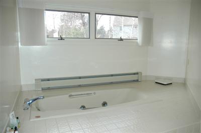 40 Mashnee Road Bourne, MA 02532 - Photo 10 of 12 a bathroom with a bathtub