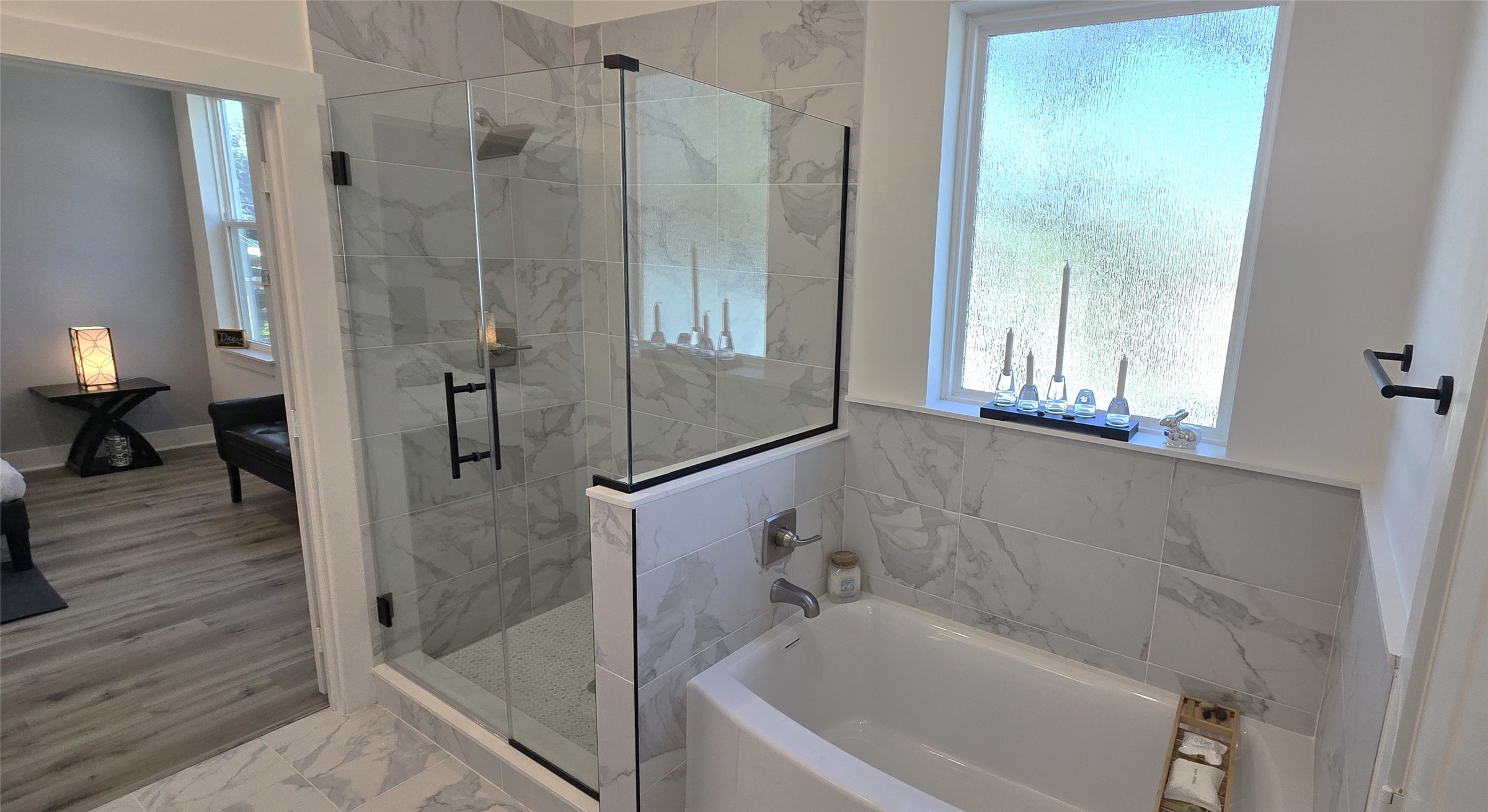 4922 Hoover Street, Unit F Houston, TX 77092 - Photo 13 of 26 Luxe primary bathroom suite with standing glass enclosed shower and separate soaking garden tub.