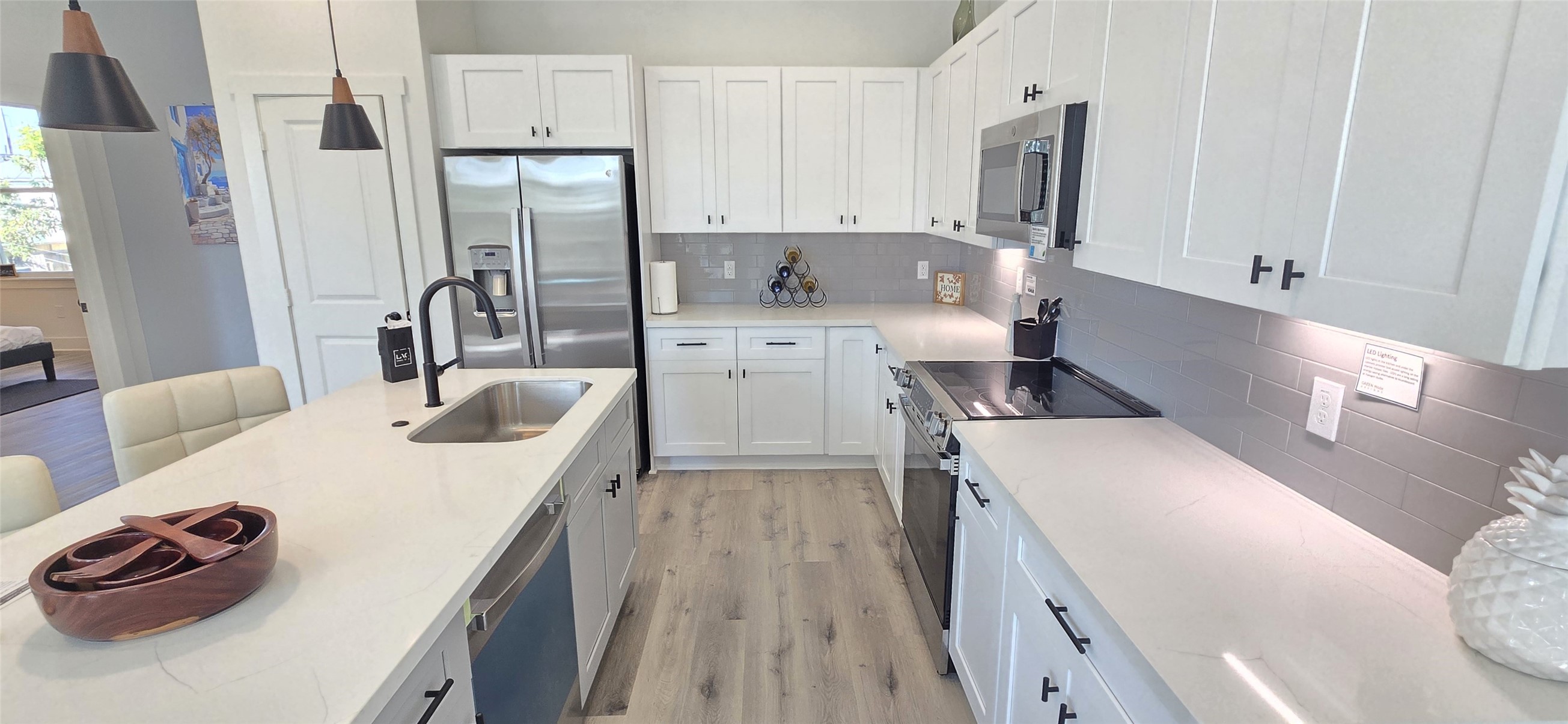 4922 Hoover Street, Unit F Houston, TX 77092 - Photo 5 of 26 Island kitchen with shaker soft close cabinet and drawers throughout.