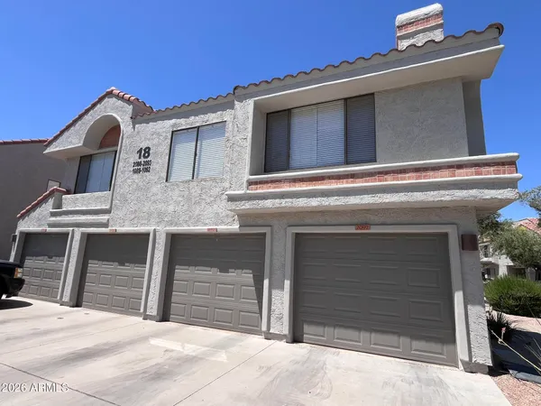 a view of house with garage