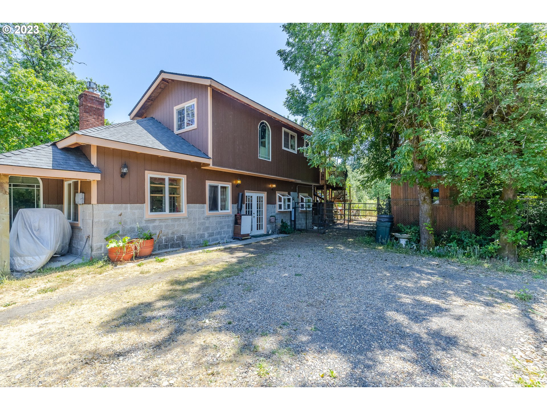 6585 Main Street Springfield, OR 97478 - Photo 11 of 30 a view of a house with backyard and sitting area