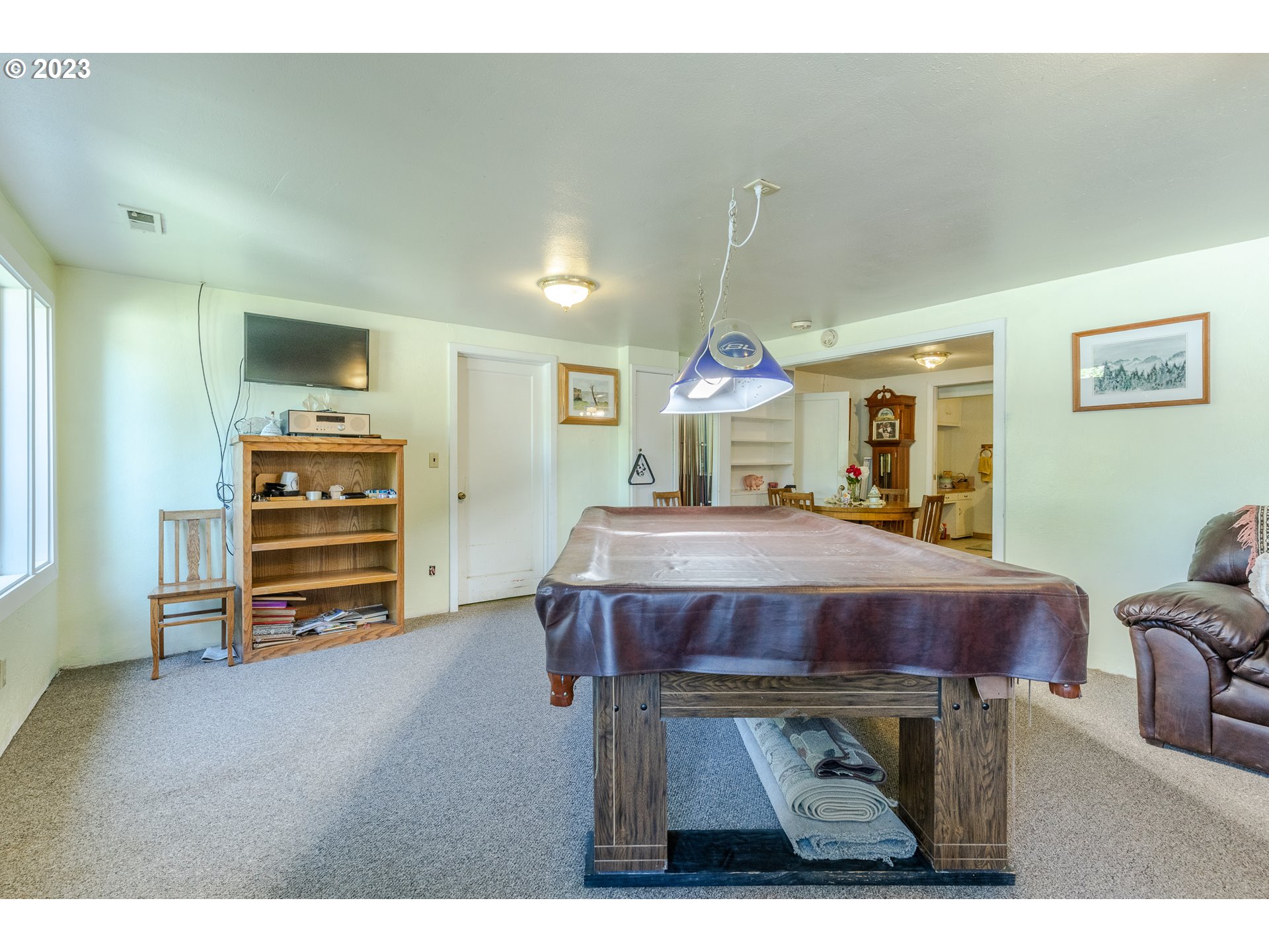 6585 Main Street Springfield, OR 97478 - Photo 12 of 30 a living room with furniture and a flat screen tv