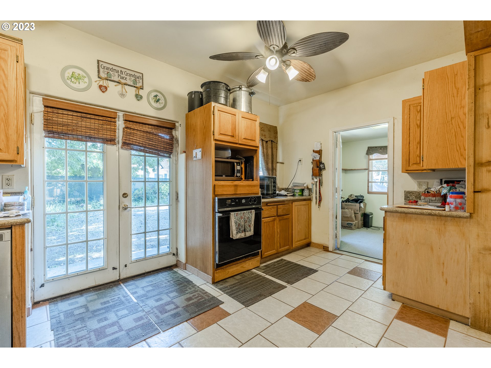6585 Main Street Springfield, OR 97478 - Photo 19 of 30 a open kitchen with stainless steel appliances granite countertop a stove top oven a sink dishwasher and a refrigerator with wooden floor