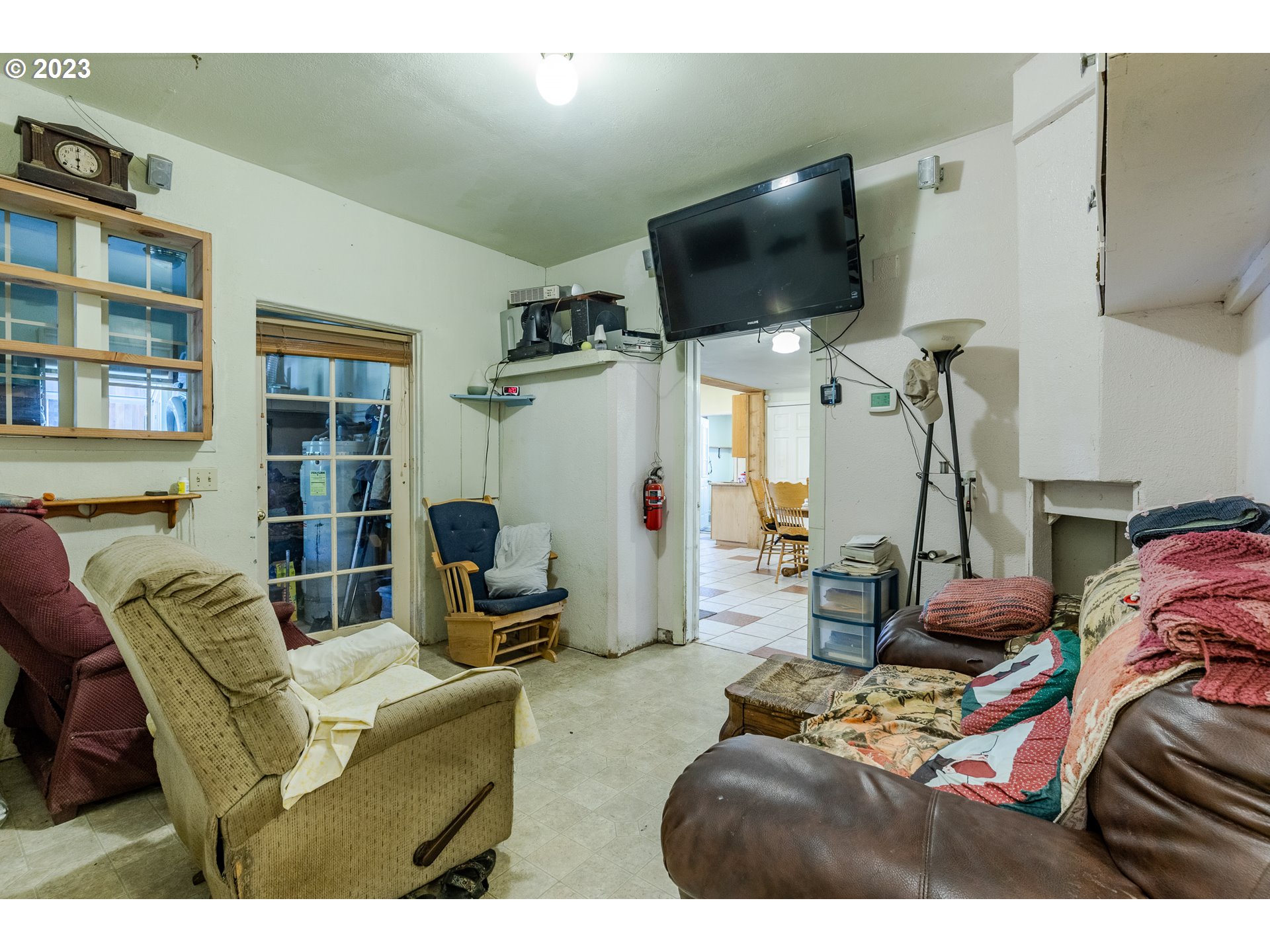6585 Main Street Springfield, OR 97478 - Photo 25 of 30 a living room with furniture and a flat screen tv