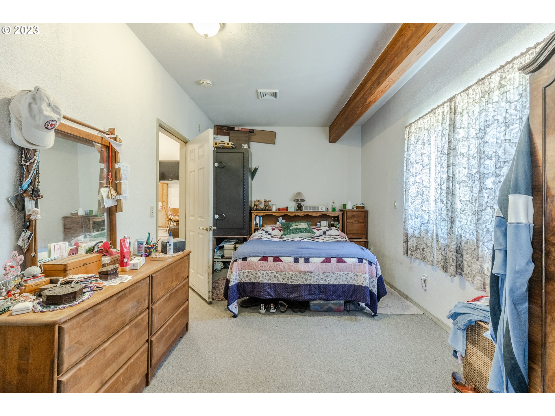 6585 Main Street Springfield, OR 97478 - Photo 26 of 30 a bedroom with a bed dresser and a window